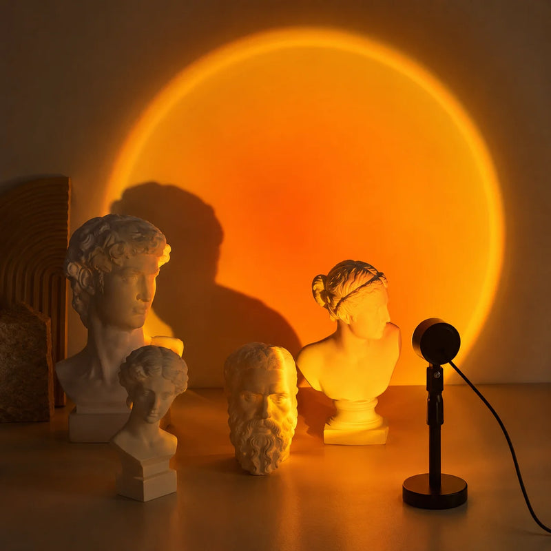Golden hour sunset projection lamp casting warm light on a wall