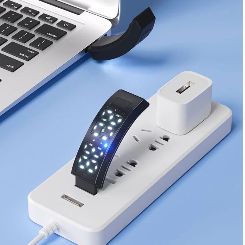 Rechargeable vibrating alarm wristband charging by USB on a laptop and wall charger