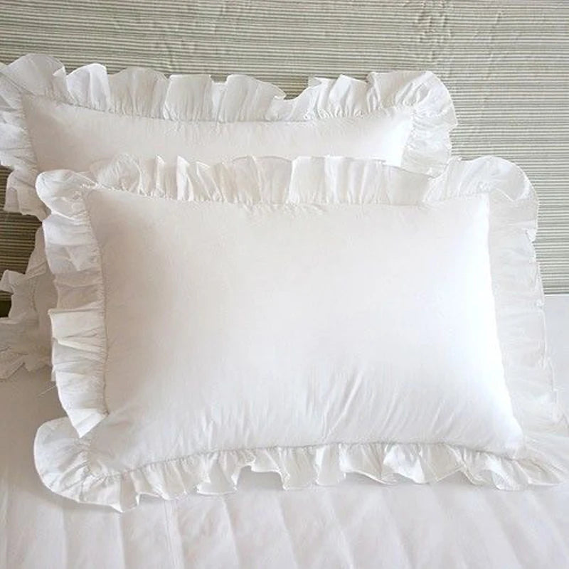 Ruffled pillowcase in soft shabby chic style on a bed