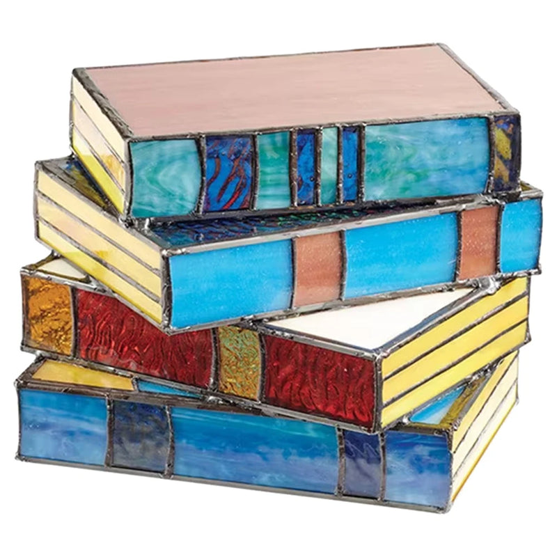 Stacked books lamp glowing on a nightstand
